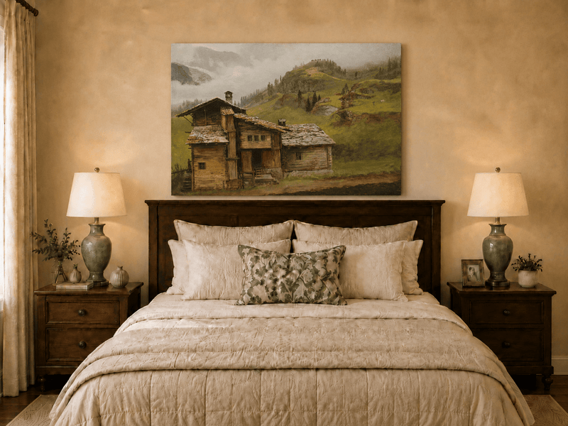 Unframed hand-painted alpine landscape oil painting with a chalet, pasture and bell tower displayed above a wooden bed in a neutral bedroom.