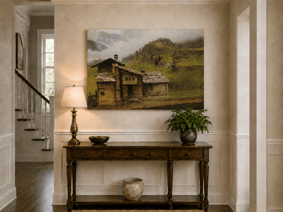 Unframed hand-painted alpine landscape oil painting with a chalet, pasture and bell tower displayed above an entryway console table.