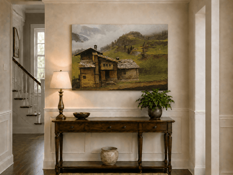 Unframed hand-painted alpine landscape oil painting with a chalet, pasture and bell tower displayed above an entryway console table.