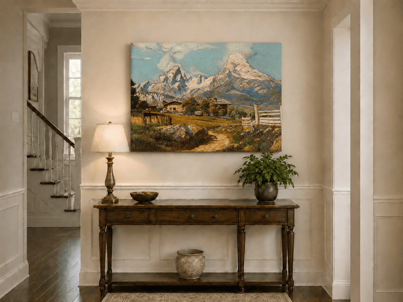 Unframed hand-painted alpine farmhouse oil painting beneath distant snow-capped peaks displayed above an entryway console table.