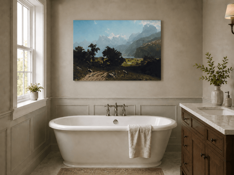 Unframed hand-painted alpine valley oil painting with a lake and layered mountain peaks displayed above a freestanding bathtub.