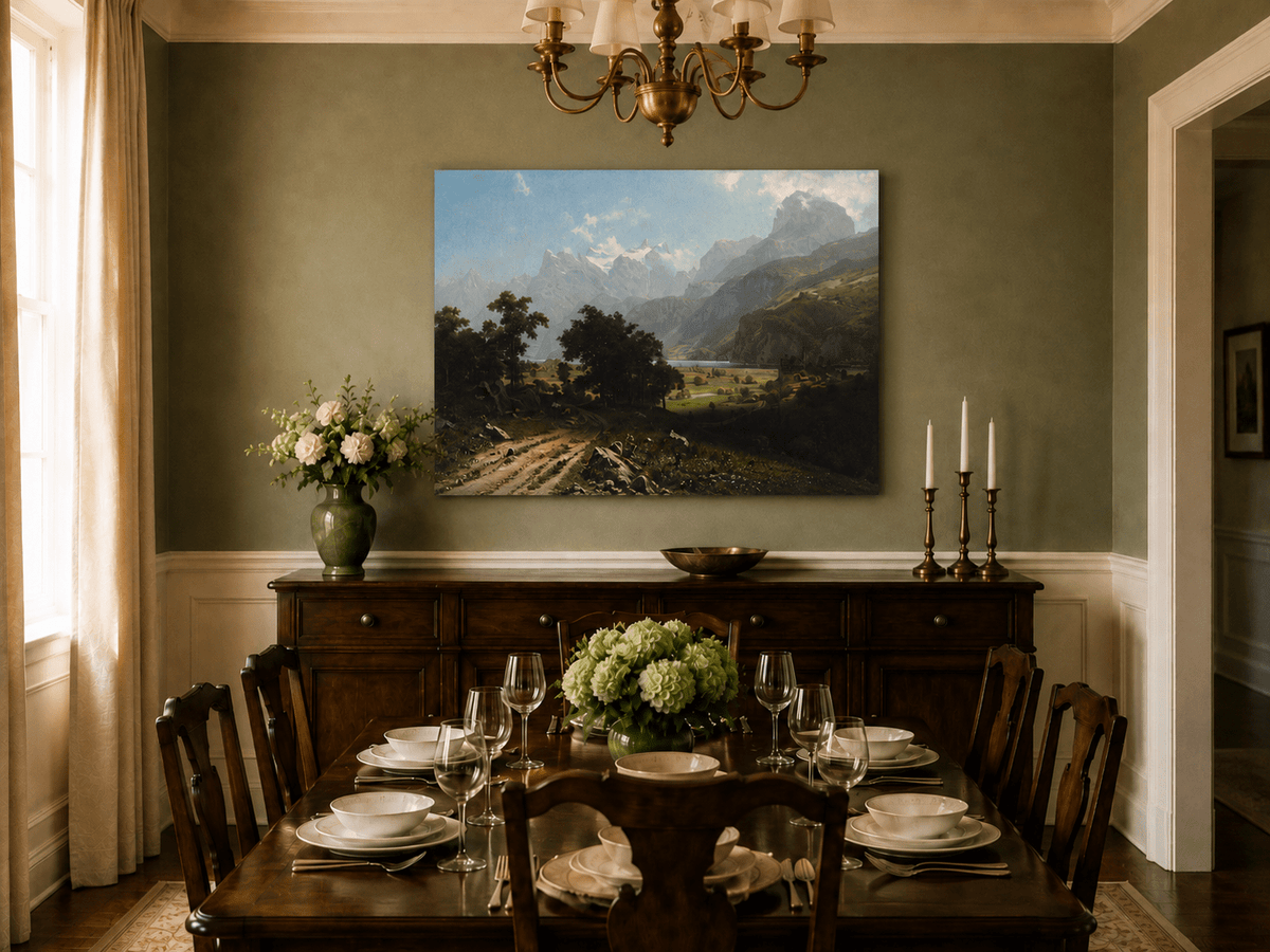 Unframed hand-painted alpine valley oil painting with a lake and layered mountain peaks displayed above a formal dining table.