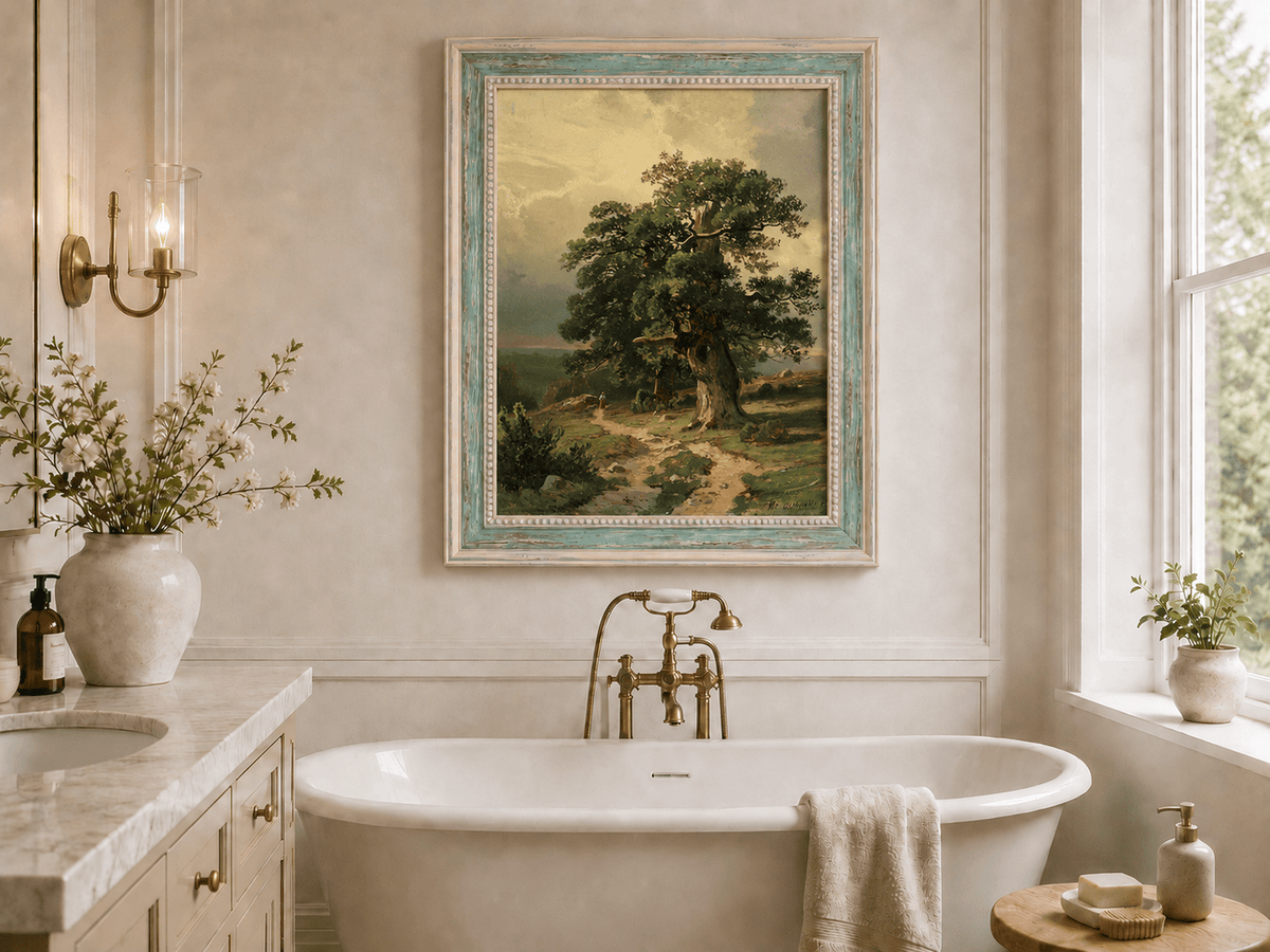 Framed hand-painted landscape oil painting with an ancient oak tree and winding path displayed above a freestanding bathtub.