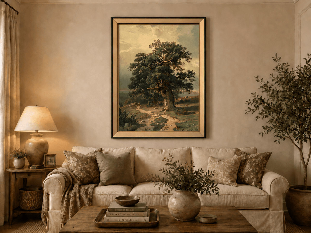 Framed hand-painted landscape oil painting with an ancient oak tree and winding path displayed above a neutral living room sofa.