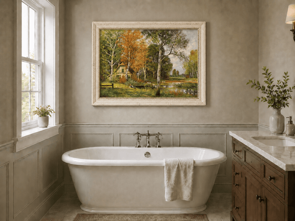 Framed hand-painted autumn riverside oil painting with a cottage among golden birch trees displayed above a freestanding bathtub.
