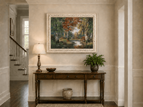 Framed hand-painted autumn forest lake oil painting with colorful trees and reflections displayed above an entryway console table.
