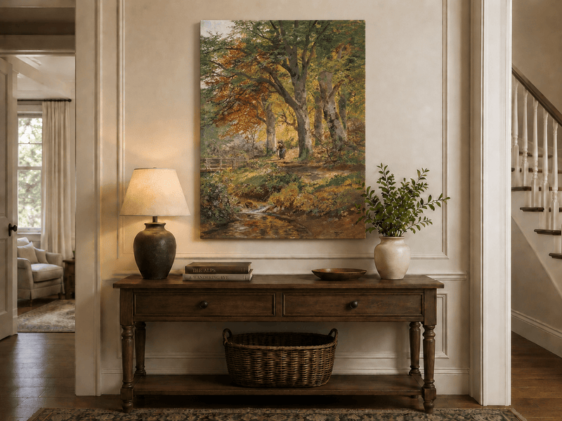 Unframed hand-painted autumn forest oil painting with a leaf-covered path beside a stream displayed above an entryway console table.