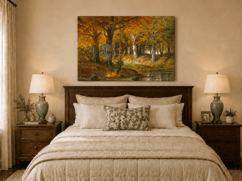 Unframed hand-painted autumn forest stream oil painting glowing beneath golden trees displayed above a wooden bed in a neutral bedroom.