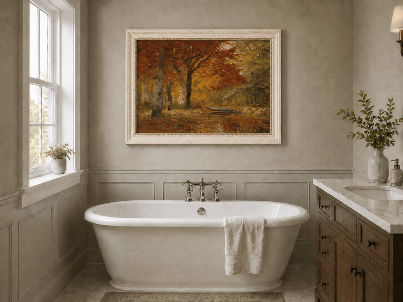 Framed hand-painted autumn forest oil painting with a stream and red-leaved trees displayed above a freestanding bathtub.