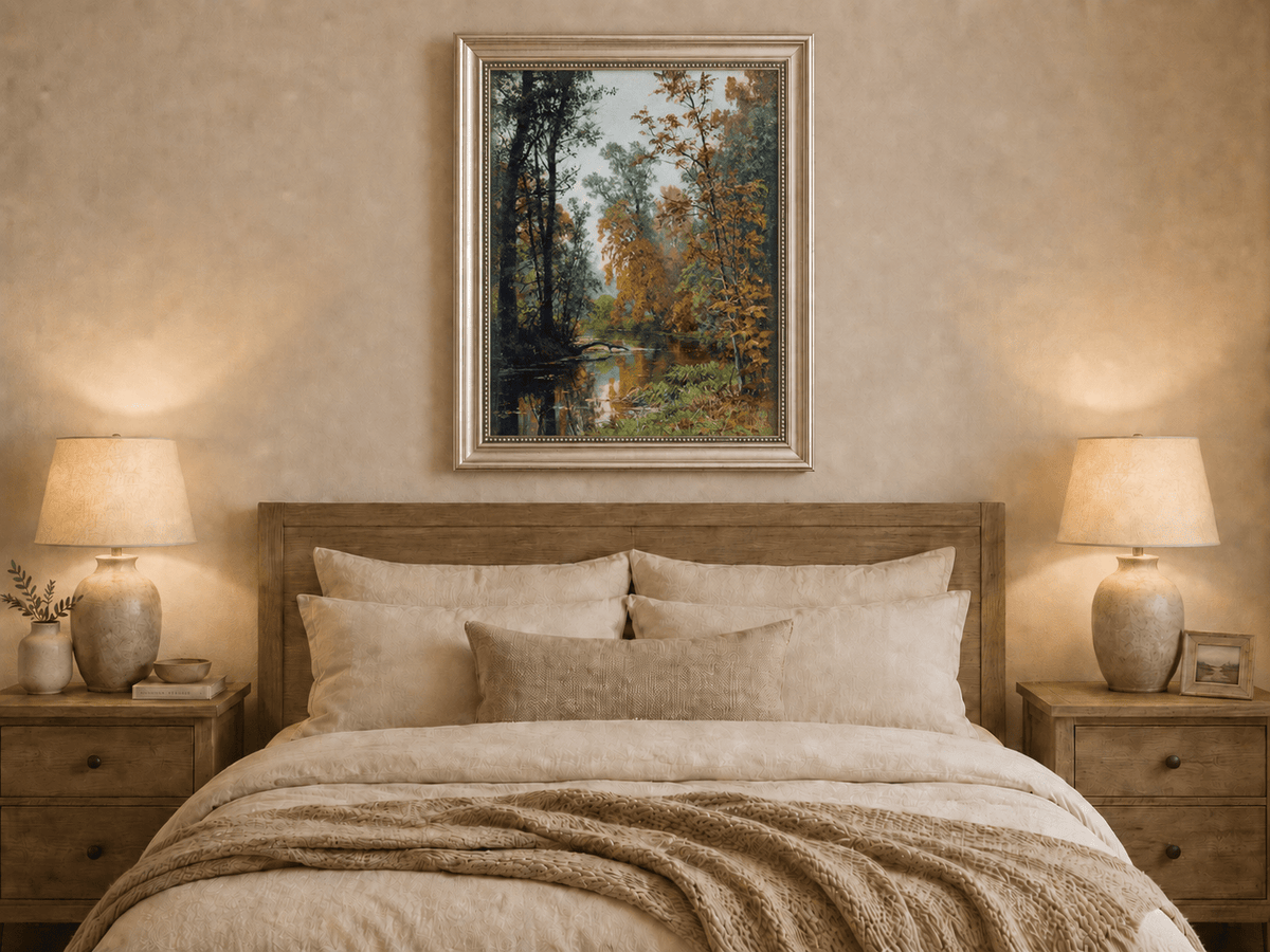 Framed hand-painted autumn forest stream oil painting with colorful trees and reflections displayed above a wooden bed in a neutral bedroom.