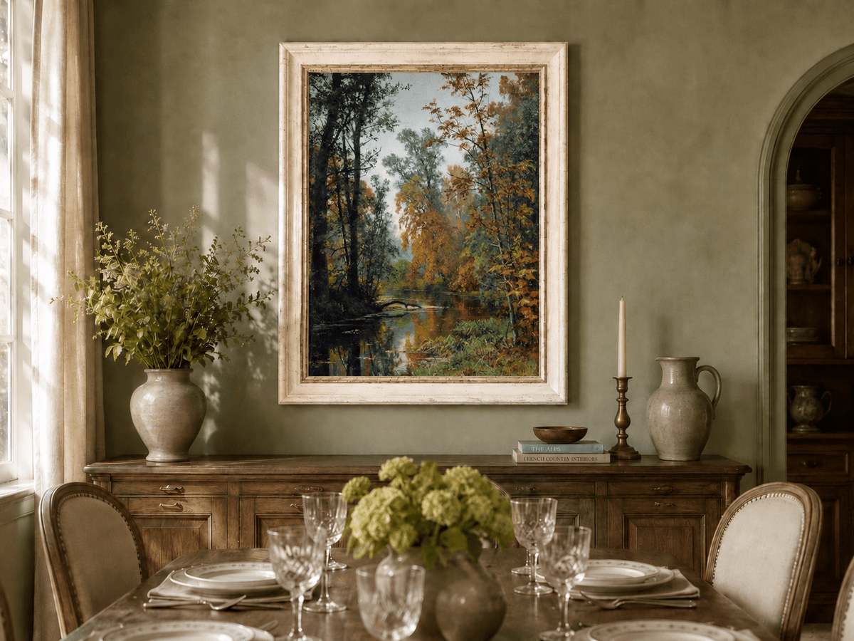 Framed hand-painted autumn forest stream oil painting with colorful trees and reflections displayed above a formal dining table.
