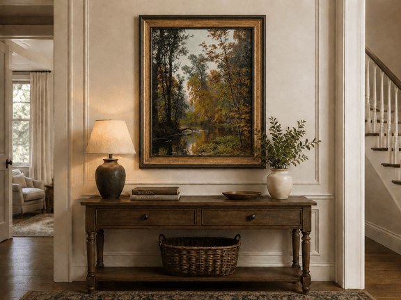 Framed hand-painted autumn forest stream oil painting with colorful trees and reflections displayed above an entryway console table.