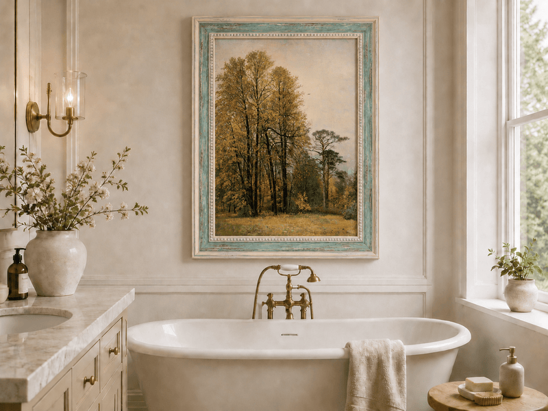 Framed hand-painted autumn forest oil painting with tall golden-leaved trees displayed above a freestanding bathtub.