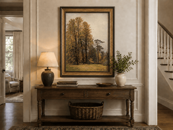 Framed hand-painted autumn forest oil painting with tall golden-leaved trees displayed above an entryway console table.