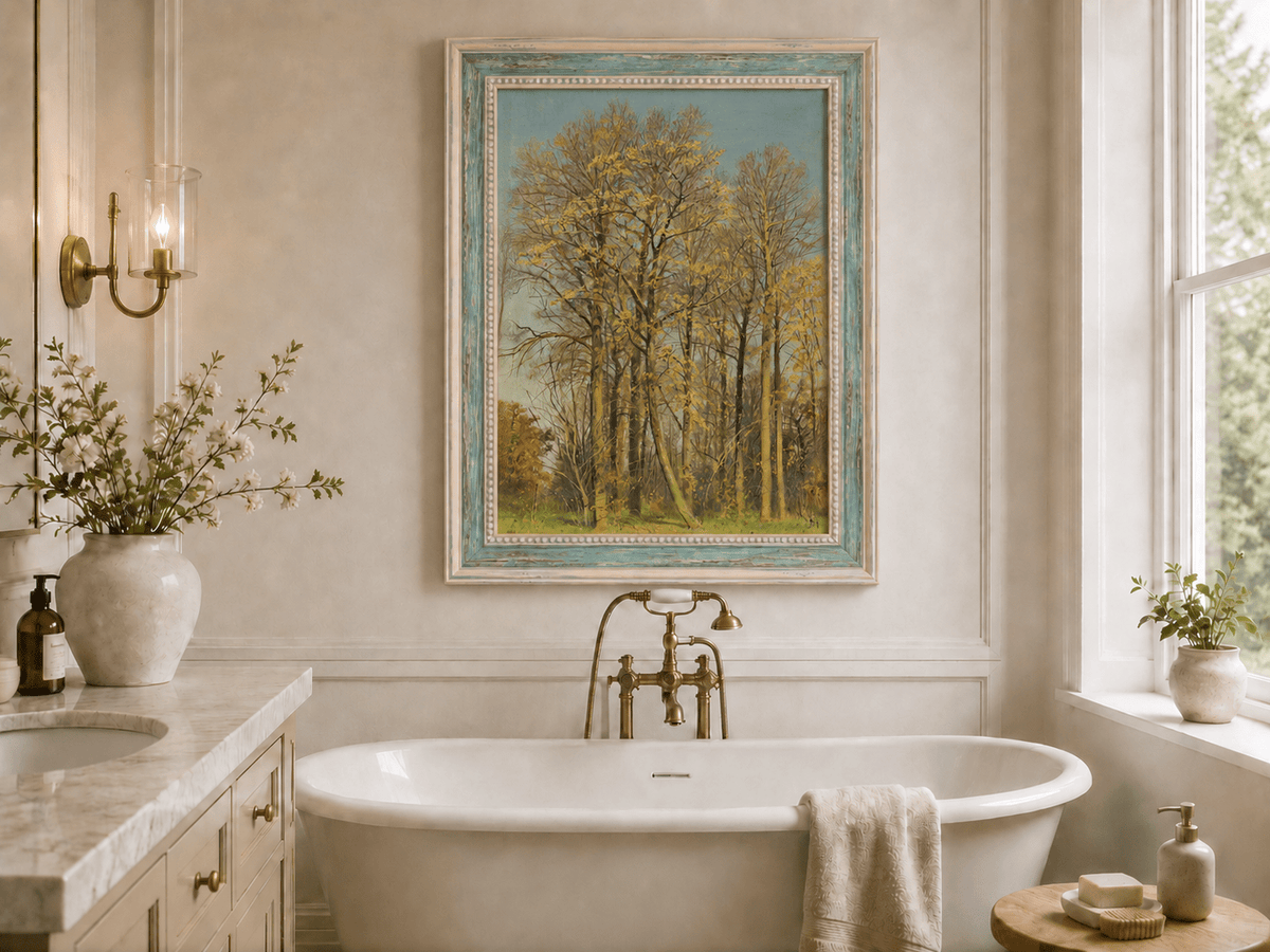Framed hand-painted autumn forest oil painting with slender golden trees and bright foliage displayed above a freestanding bathtub.