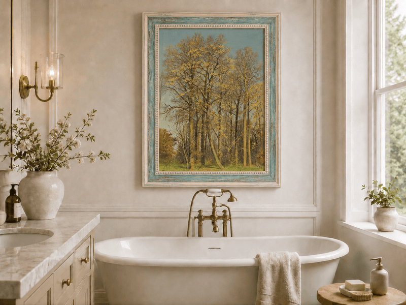 Framed hand-painted autumn forest oil painting with slender golden trees and bright foliage displayed above a freestanding bathtub.