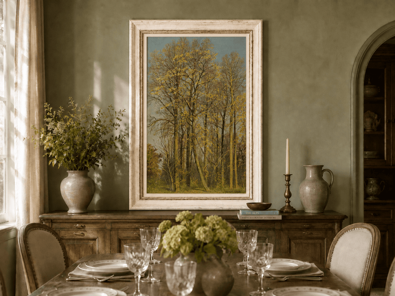Framed hand-painted autumn forest oil painting with slender golden trees and bright foliage displayed above a formal dining table.