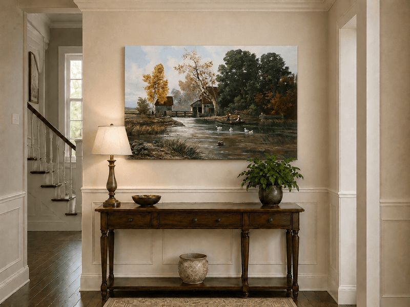 Unframed hand-painted autumn river mill oil painting with a boat and swans on the water displayed above an entryway console table.