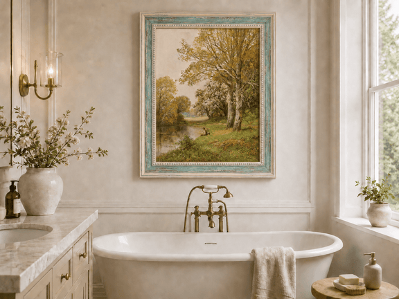Framed hand-painted autumn riverside oil painting with a seated figure beneath birch trees displayed above a freestanding bathtub.
