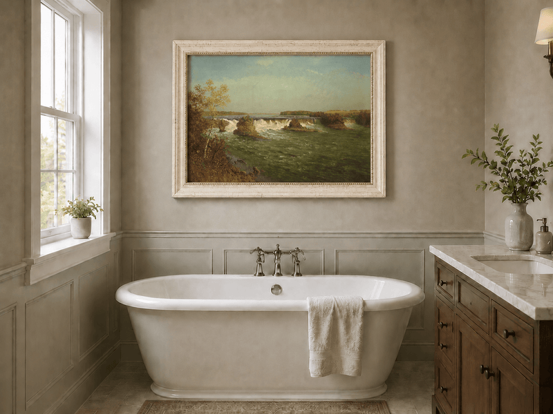 Framed hand-painted autumn waterfall oil painting with rocky islands and a broad river displayed above a freestanding bathtub.