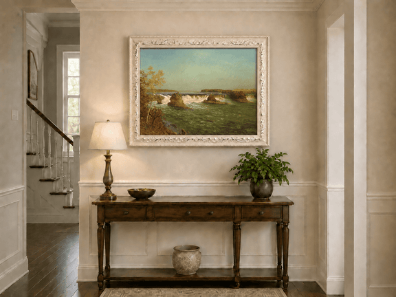 Framed hand-painted autumn waterfall oil painting with rocky islands and a broad river displayed above an entryway console table.