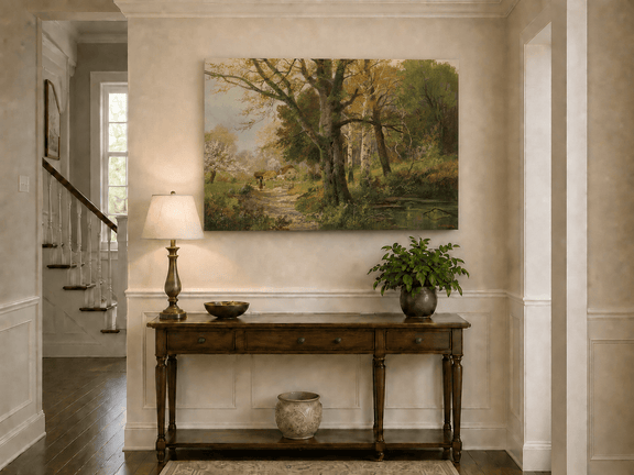 Unframed hand-painted autumn woodland oil painting with a path leading to a country cottage displayed above an entryway console table.