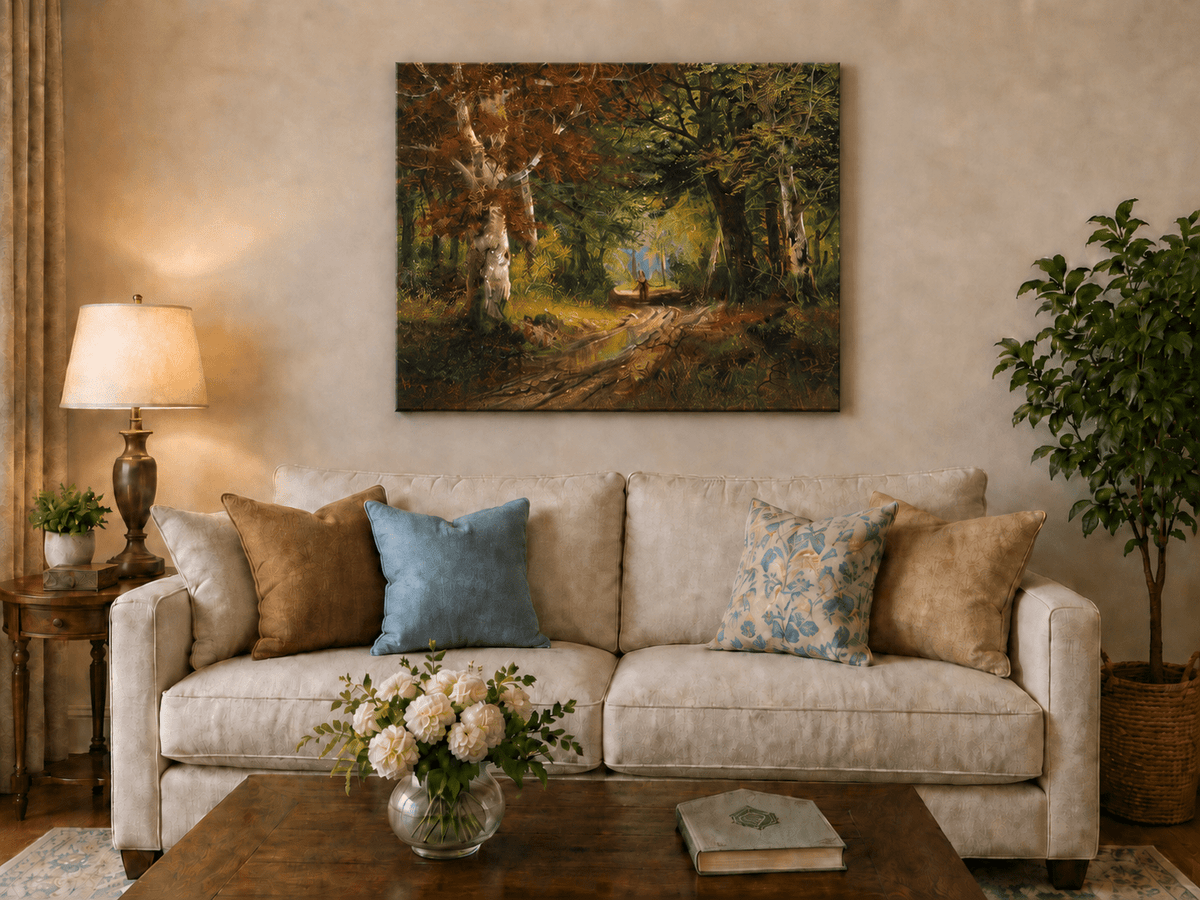 Unframed hand-painted autumn woodland path oil painting beneath tall golden trees displayed above a neutral living room sofa.