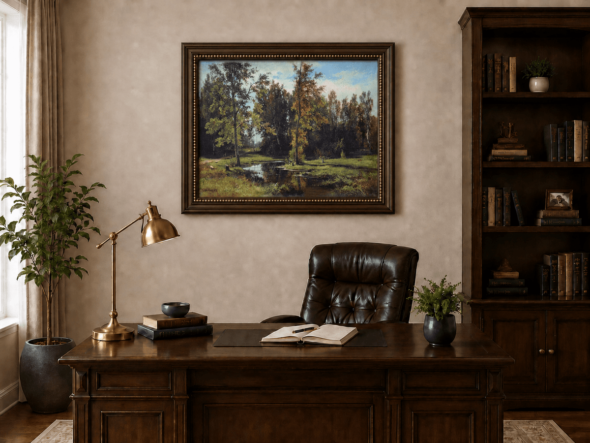 Framed hand-painted autumn woodland pond oil painting with trees reflected in still water displayed above a traditional home office desk.