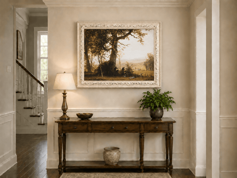 Framed hand-painted historical landscape oil painting with a battle scene in the forest displayed above an entryway console table.