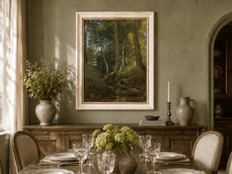 Framed hand-painted birch forest oil painting with a rocky stream displayed above a formal dining table.