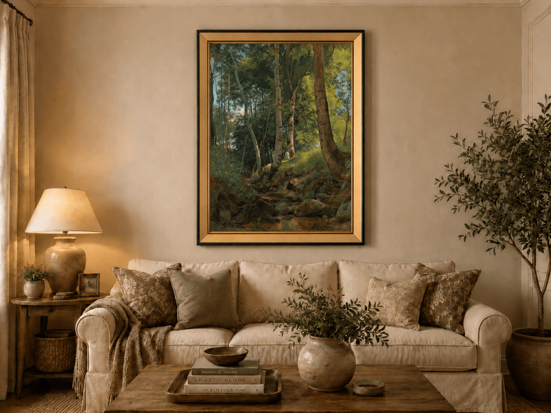 Framed hand-painted birch forest oil painting with a rocky stream displayed above a neutral living room sofa.