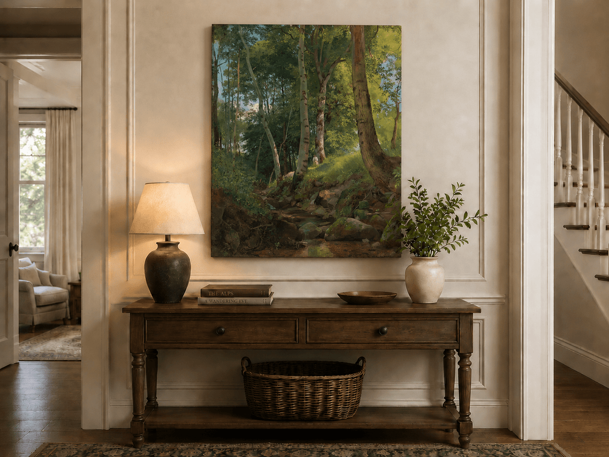 Unframed hand-painted birch forest oil painting with a rocky stream displayed above an entryway console table.