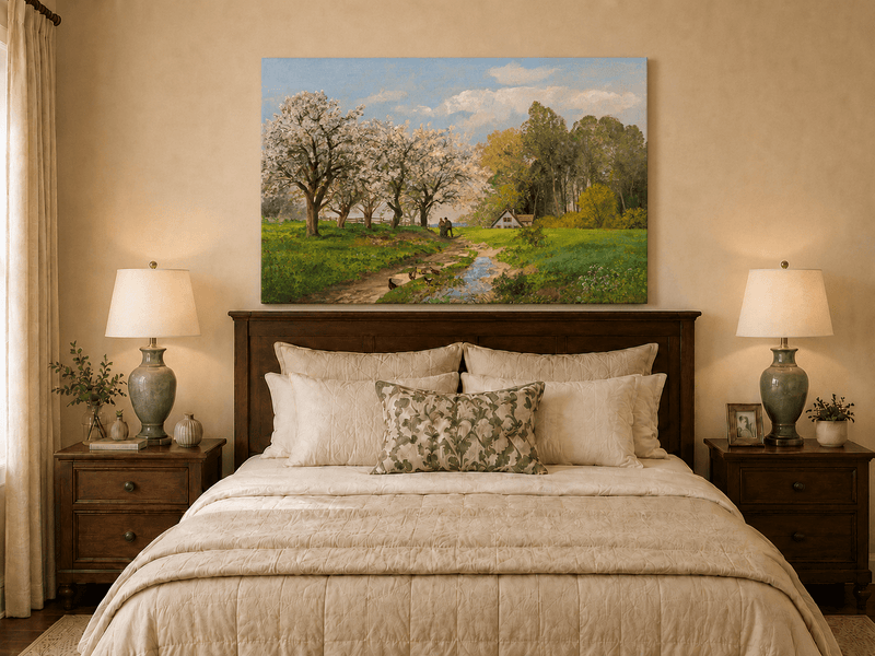 Unframed hand-painted blooming orchard oil painting with a winding path leading to a cottage displayed above a wooden bed in a neutral bedroom.
