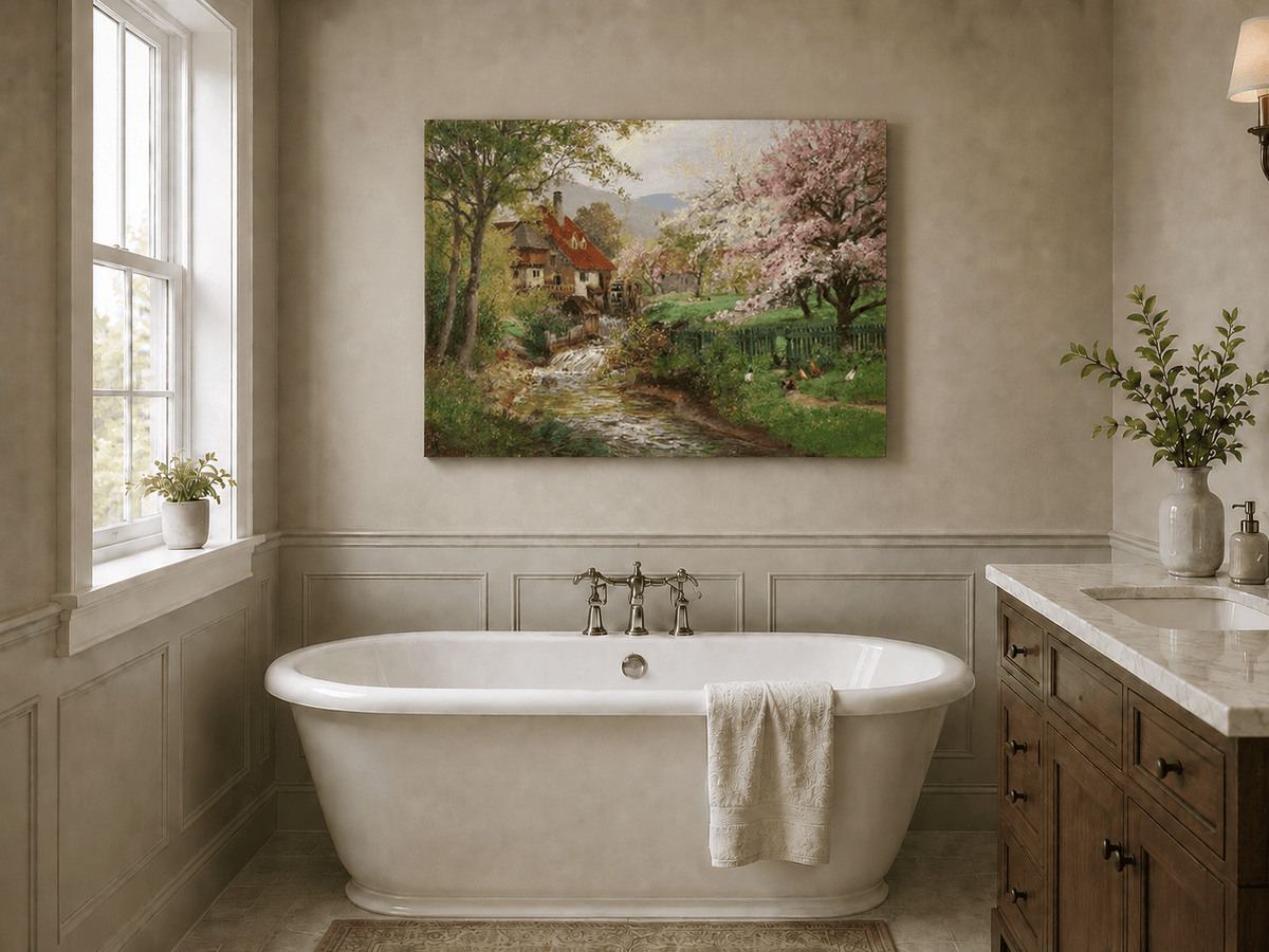 Unframed hand-painted spring mill house oil painting beside a flower-lined woodland stream displayed above a freestanding bathtub.