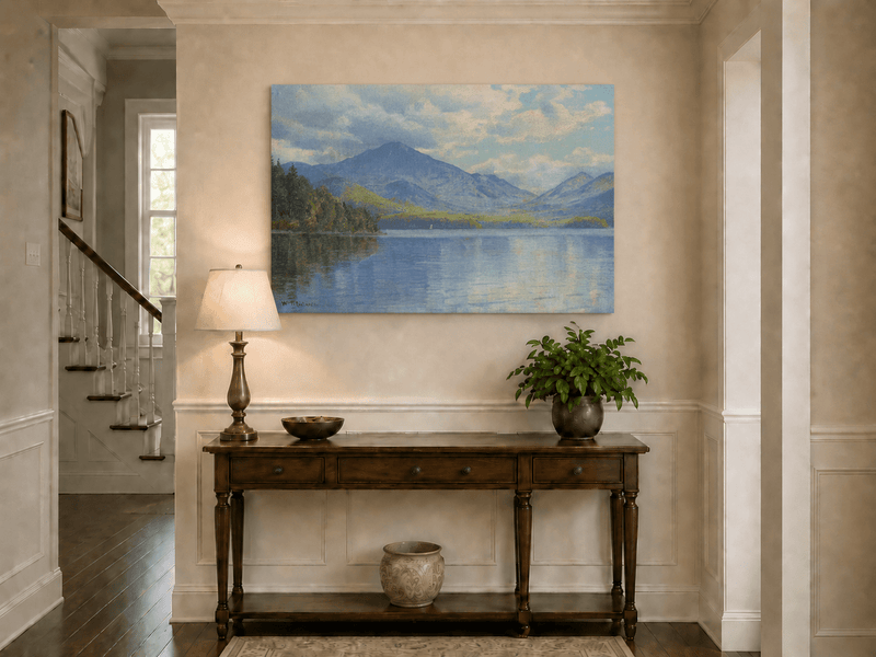 Unframed hand-painted lake oil painting with calm reflections and a forested shoreline displayed above an entryway console table.