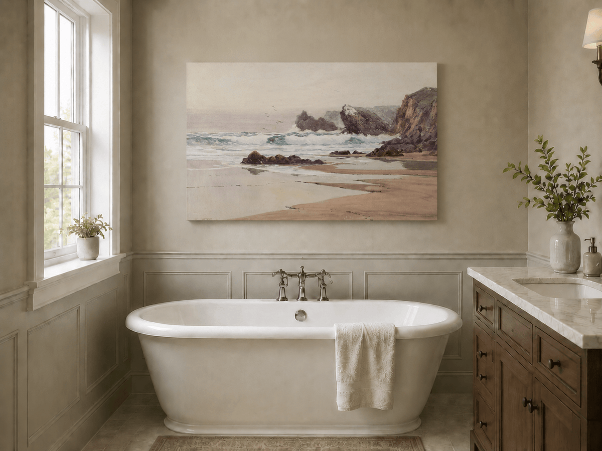 Unframed hand-painted coastal beach oil painting with crashing waves and cliffside rocks displayed above a freestanding bathtub.