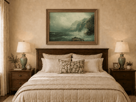 Framed hand-painted coastal cliff oil painting with crashing waves beneath a misty sky displayed above a wooden bed in a neutral bedroom.