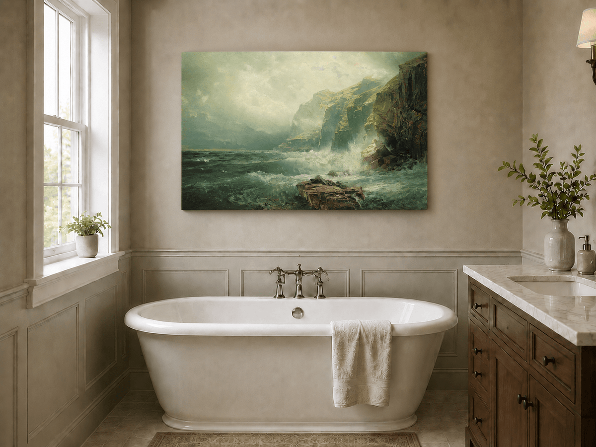 Unframed hand-painted coastal cliff oil painting with crashing waves beneath a misty sky displayed above a freestanding bathtub.