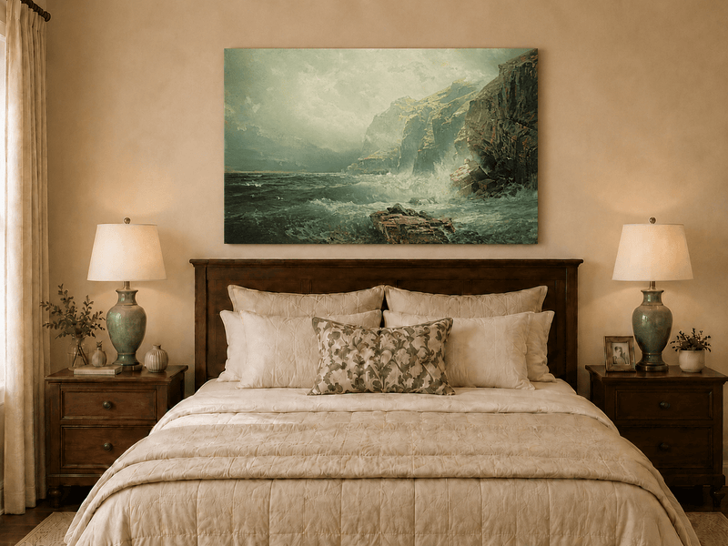 Unframed hand-painted coastal cliff oil painting with crashing waves beneath a misty sky displayed above a wooden bed in a neutral bedroom.