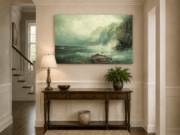 Unframed hand-painted coastal cliff oil painting with crashing waves beneath a misty sky displayed above an entryway console table.