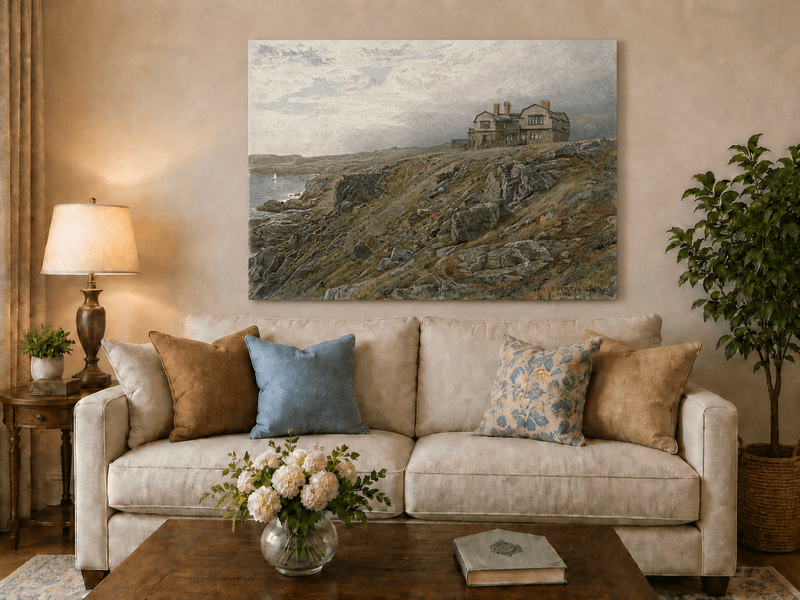 Unframed hand-painted coastal oil painting with a cliff house, rocky slopes and seaside view displayed above a neutral living room sofa.