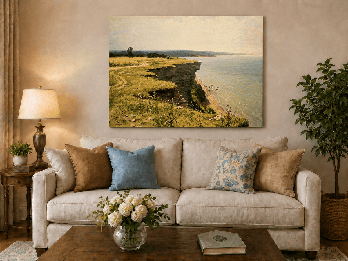 Unframed hand-painted coastal landscape oil painting with a grassy cliff and expansive sea view displayed above a neutral living room sofa.