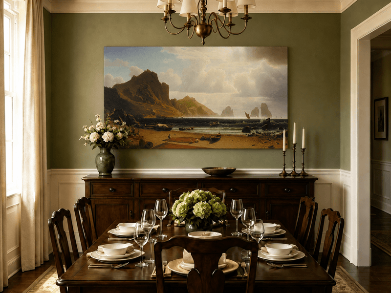 Unframed hand-painted coastal cliffs oil painting with fishing boats and figures on a rocky beach displayed above a formal dining table.