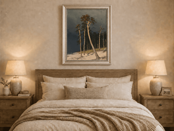 Framed hand-painted coastal forest oil painting with tall pines on a sandy shore displayed above a wooden bed in a neutral bedroom.