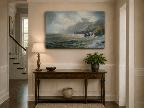 Unframed hand-painted coastal mountain oil painting with waves breaking on a rocky shore displayed above an entryway console table.