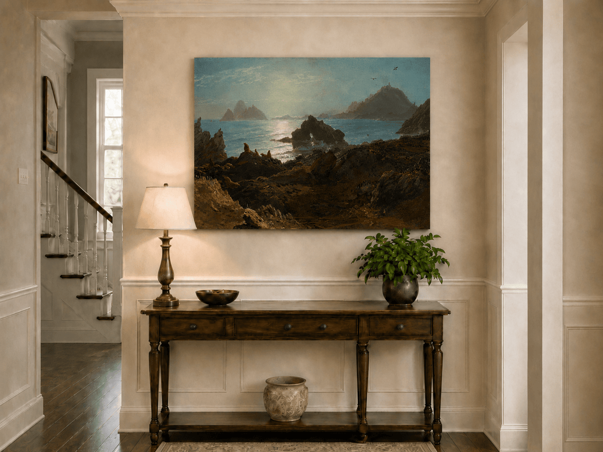 Unframed hand-painted coastal oil painting with a rocky shoreline, wildlife and distant sea stacks displayed above an entryway console table.