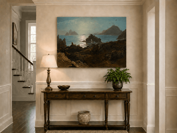 Unframed hand-painted coastal oil painting with a rocky shoreline, wildlife and distant sea stacks displayed above an entryway console table.