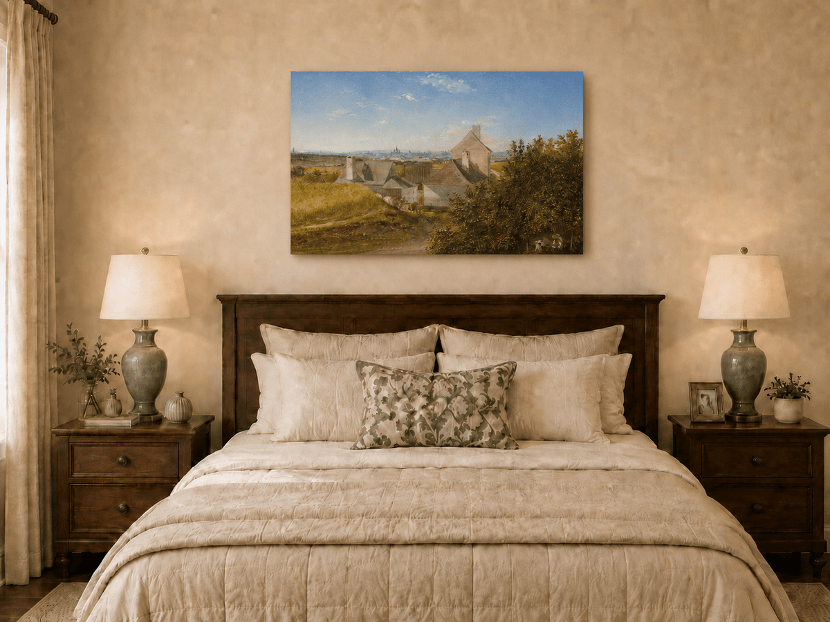 Unframed hand-painted country houses oil painting with a winding road and distant city view displayed above a wooden bed in a neutral bedroom.