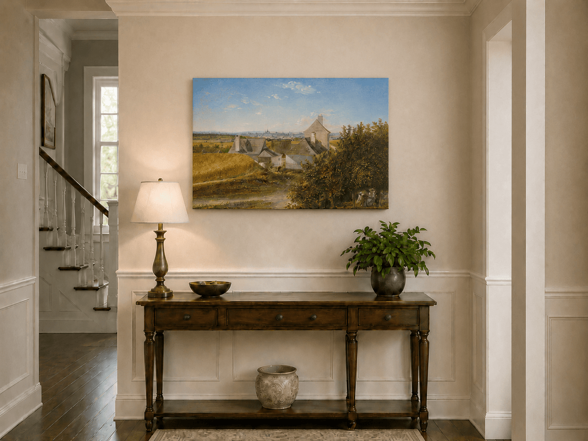 Unframed hand-painted country houses oil painting with a winding road and distant city view displayed above an entryway console table.