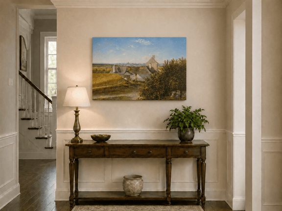Unframed hand-painted country houses oil painting with a winding road and distant city view displayed above an entryway console table.